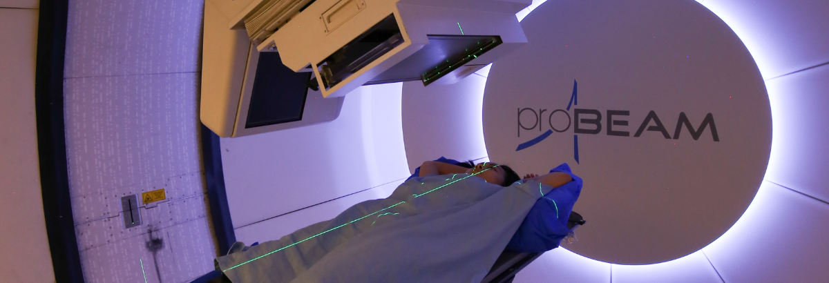 A New York Proton Center Patient on the treatment couch in a Varian ProBeam Proton Gantry room.